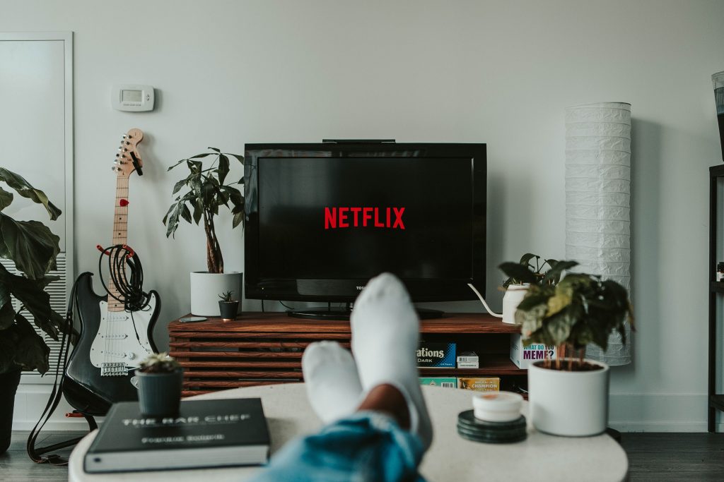A man watching Netflix on TV.
