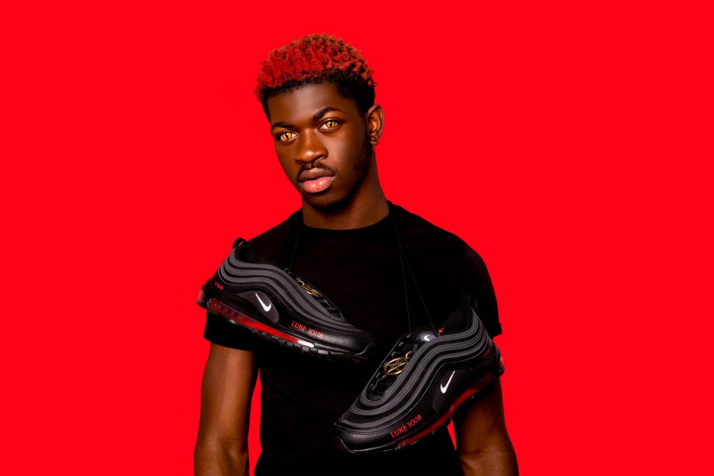 Lil Nas X with pair of Satanic Shoes by MSCHF