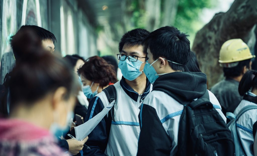 Students from China wearing masks amid Covid-19 pandemic by Unsplash