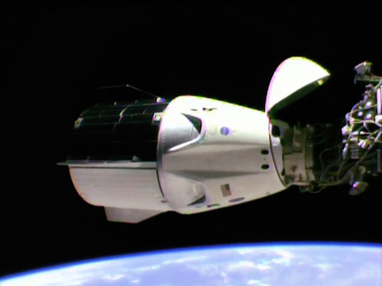 SpaceX Dragon ship docks at space station to re-supply astronauts