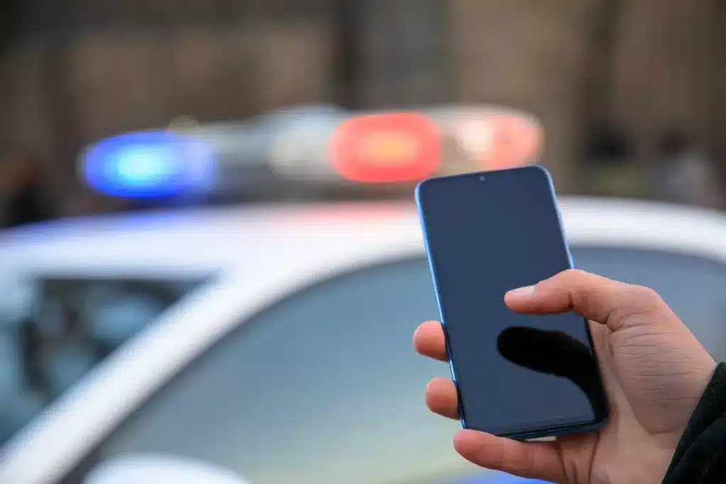 police_holding_phone