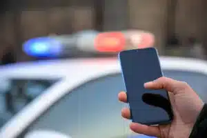 police_holding_phone