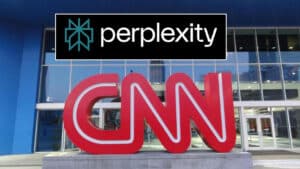 Red, oversized 'CNN' letters sculpture outside a glass-front building with a blue exterior; a black 'perplexity' logo is overlaid above.