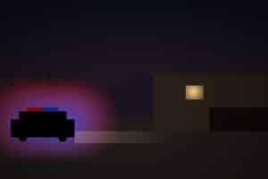 Sheriff vehicle outside a quiet desert home at night