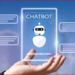 Hand holds a glowing card labeled CHATBOT with a robotic avatar and floating chat bubbles on a blue digital background.
