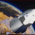 Space shuttle orbiting Earth with a curved blue atmosphere edge and stars in the background, showing a view from space.