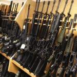AR-15 rifles line a shelf in the gun library at the ATF National Tracing Center in Martinsburg, West Virginia