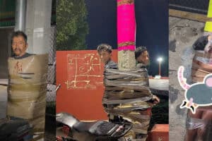 Several men are tied up with duct tape to posts and walls in a dim outdoor area, with motorcycles nearby and a cartoon mouse sticker on the right.