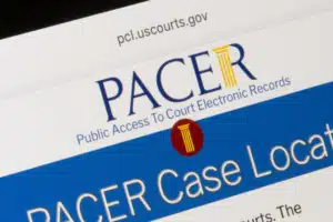 Screenshot of a PACER header on pcl.uscourts.gov showing the PACER logo and blue banner that reads 'PACER Case Locator'.