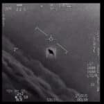 IR screen with targeting reticle centered on a small rectangular target; dark hole in the rectangle, surrounded by flight HUD markings