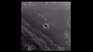 IR screen with targeting reticle centered on a small rectangular target; dark hole in the rectangle, surrounded by flight HUD markings
