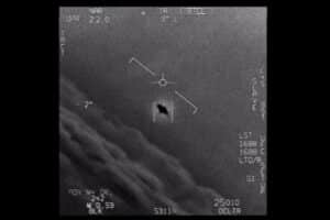 IR screen with targeting reticle centered on a small rectangular target; dark hole in the rectangle, surrounded by flight HUD markings