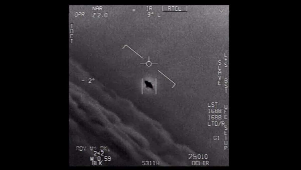 IR screen with targeting reticle centered on a small rectangular target; dark hole in the rectangle, surrounded by flight HUD markings