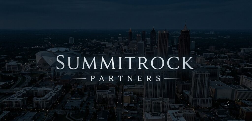 SummitRock Partners logo over a nighttime aerial view of a downtown city skyline