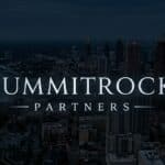 SummitRock Partners logo over a nighttime aerial view of a downtown city skyline