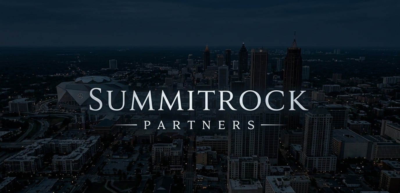 SummitRock Partners logo over a nighttime aerial view of a downtown city skyline