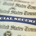 Close-up of a blue Social Security card overlaid on U.S. Treasury documents.