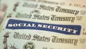 Close-up of a blue Social Security card overlaid on U.S. Treasury documents.