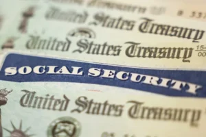 Close-up of a blue Social Security card overlaid on U.S. Treasury documents.