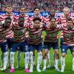 USMNT starting eleven lined up before a 2026 international match, wearing their red and white uniforms at Mercedes-Benz Stadium in Atlanta, Georgia
