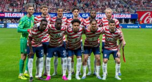 USMNT starting eleven lined up before a 2026 international match, wearing their red and white uniforms at Mercedes-Benz Stadium in Atlanta, Georgia