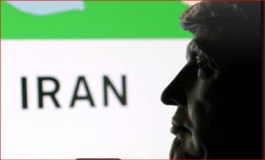 Profile view of a man facing right with the word IRAN visible in the background.
