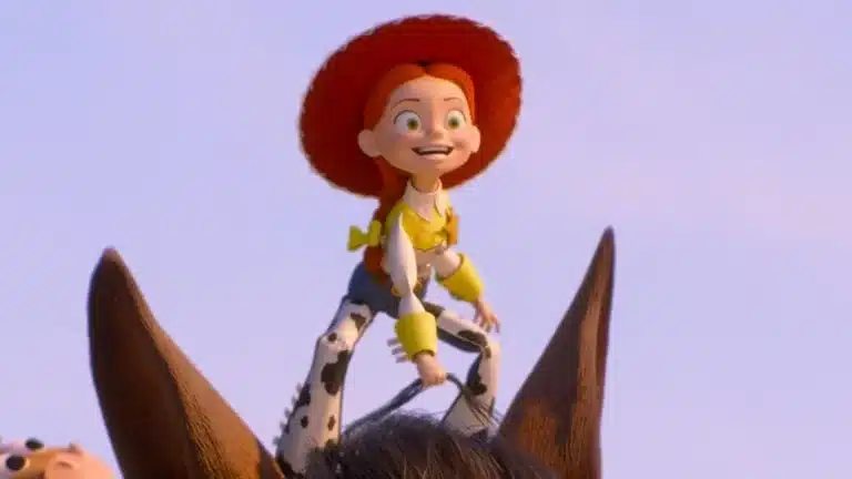 Cowgirl Jessie from Toy Story riding a brown horse against a clear sky, smiling with red hat and yellow accents on her outfit.