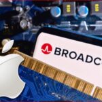 Close-up of a Broadcom logo on a computer chip with an Apple logo on a blue circuit board.
