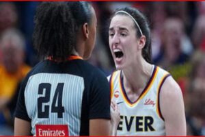 Two female basketball players argue on the court: one with jersey number 24 facing away, the other in a white Fever jersey shouting.