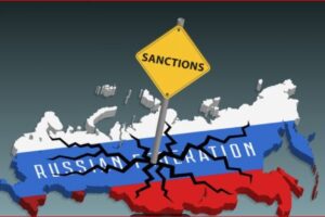 Yellow 'SANCTIONS' sign over a cracked, flag-colored map of Russia, conveying international sanctions on Russia.