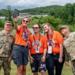 Scouts visit a U.S. Navy display at the 2026 National Jamboree amid the Scouting America diversity rollback.