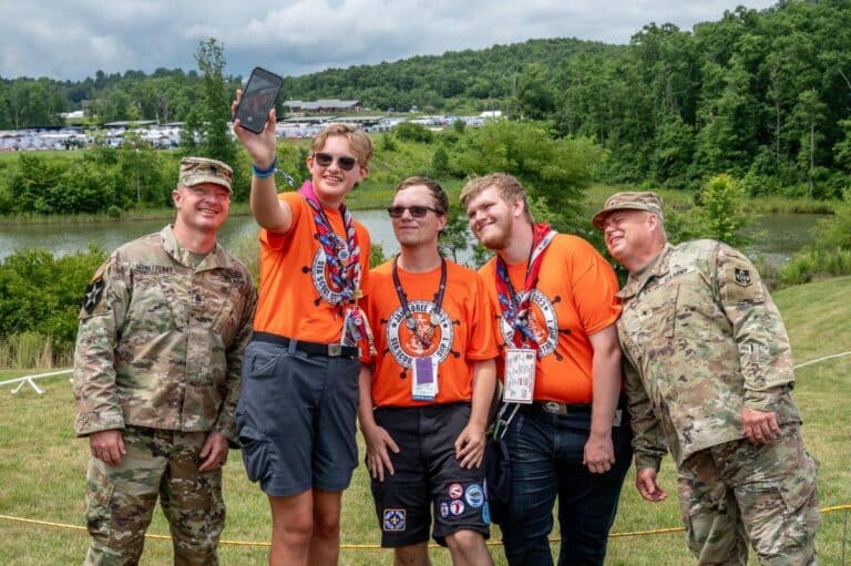 Scouts visit a U.S. Navy display at the 2026 National Jamboree amid the Scouting America diversity rollback.