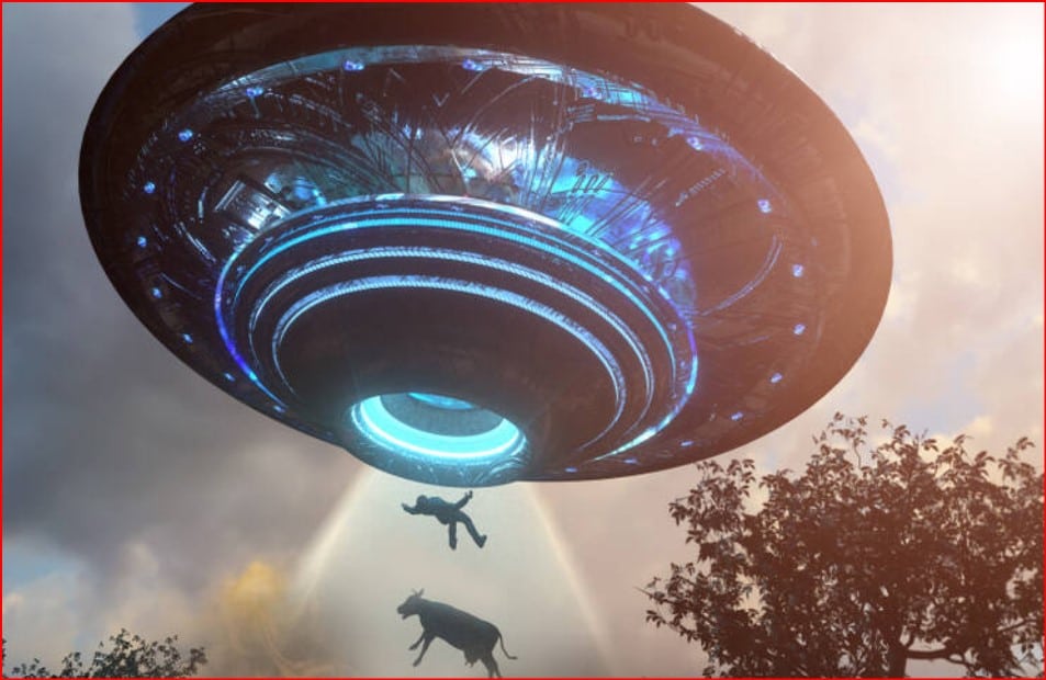 Large flying saucer with blue lights emits a beam lifting a person and a cow in a rural: sky and trees in the background.