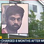 TV news screenshot: exterior apartment building with an inset mugshot of a man; banner reads 'Top Story: Husband charged 8 months after murder'.