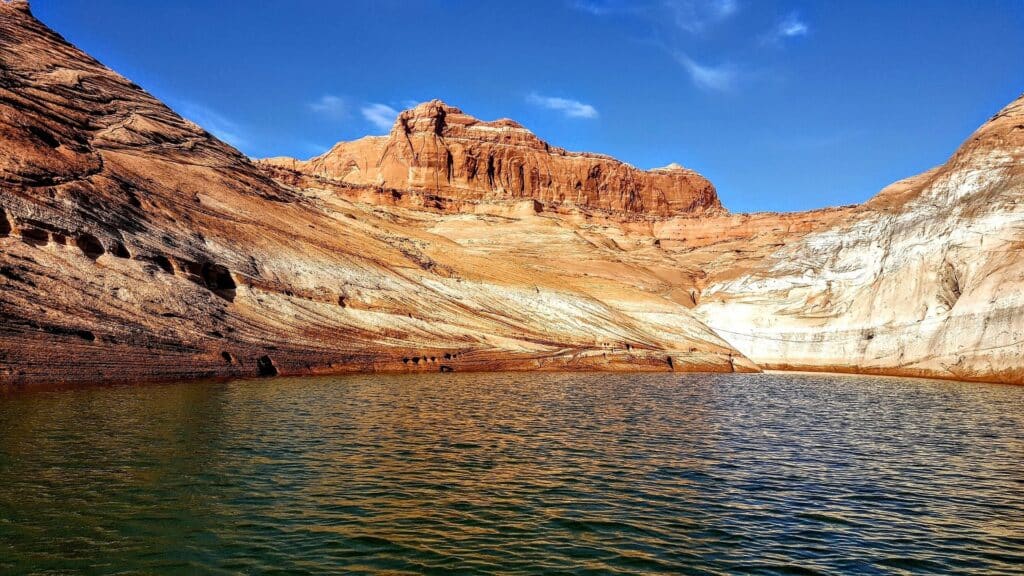 Low water exposes pale rock walls along Lake Powell near Page, Arizona.