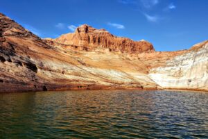 Low water exposes pale rock walls along Lake Powell near Page, Arizona.