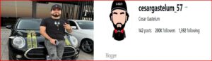 Man in a black shirt and cap leaning against a black car with yellow caution-tape on the hood, next to a social media profile header for cesargastelum_57 with a cartoon avatar.