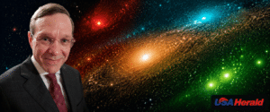 Man in suit and tie smiling at camera, overlaid on a colorful space background with the USA Herald logo in the corner.