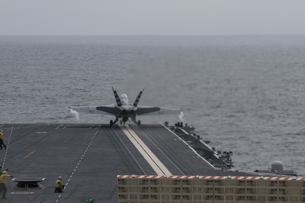 F/A-18F Super Hornet launches from the USS Gerald R. Ford using EMALS, the system targeted by Trump’s Navy steam catapults order.