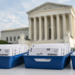 Barcoded mail-ballot envelopes in postal trays outside the U.S. Supreme Court.