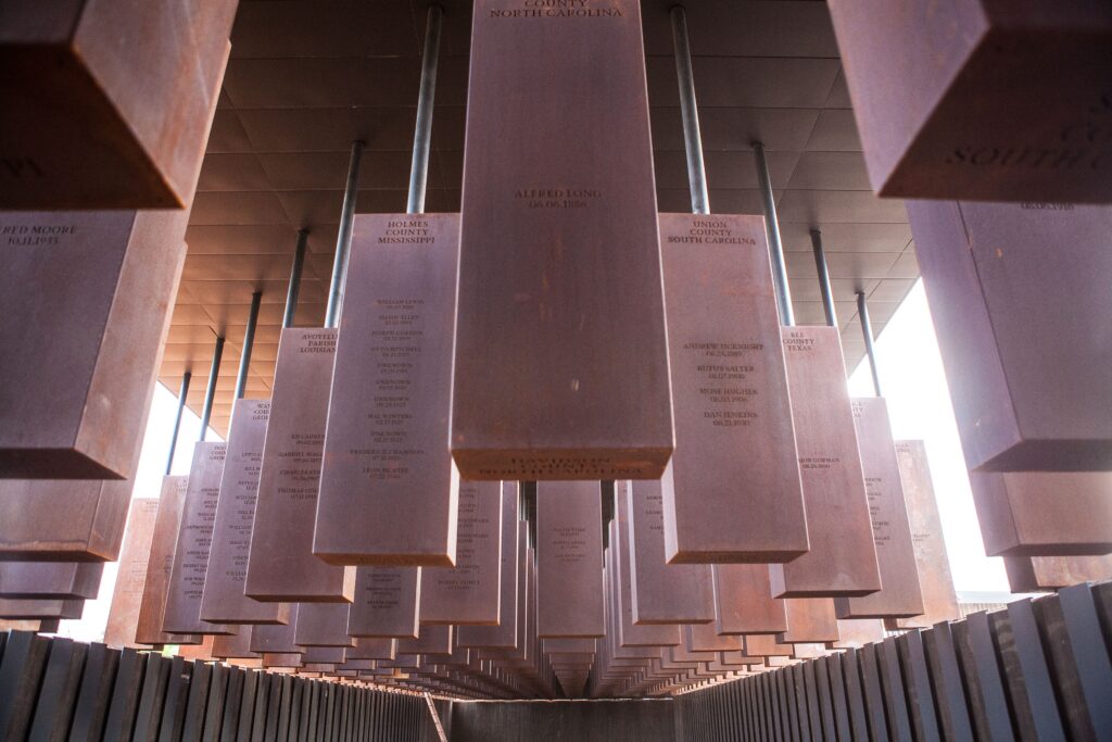 Rows of suspended steel monuments at the National Memorial for Peace and Justice in Montgomery, Alabama.