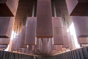 Rows of suspended steel monuments at the National Memorial for Peace and Justice in Montgomery, Alabama.