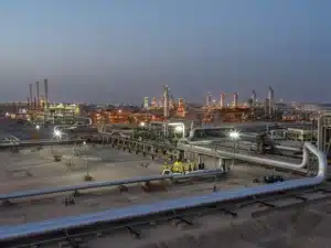 Pipes and processing equipment at Aramco’s Abqaiq complex at dusk.