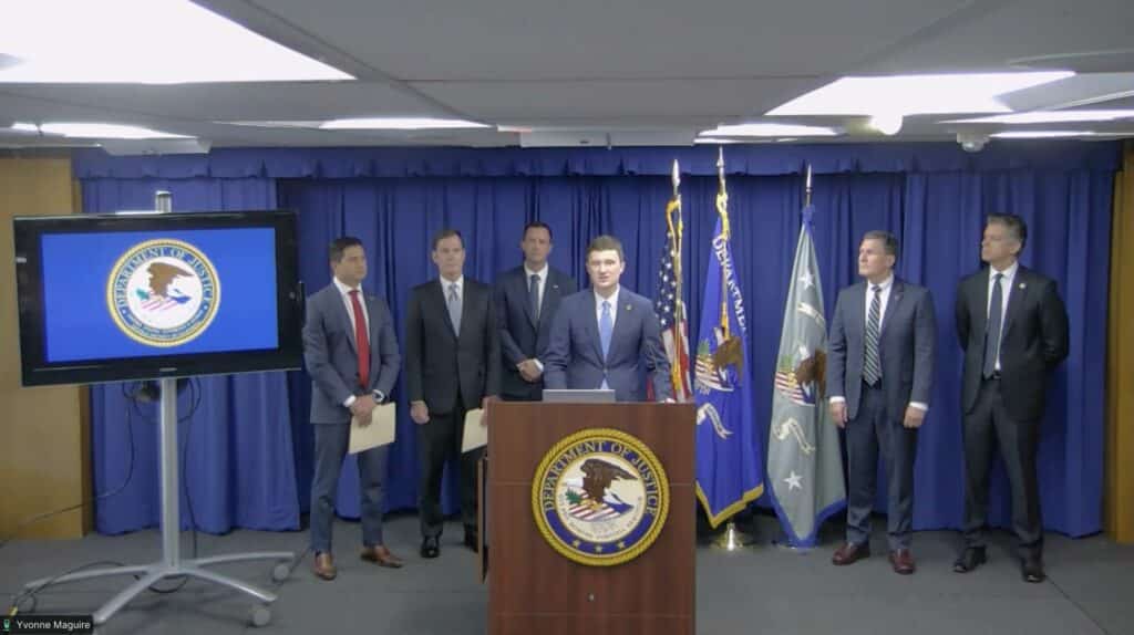 Trent McCotter speaks at a DOJ news conference about California ballots and election-related charges.