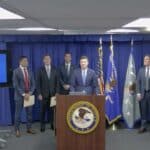 Trent McCotter speaks at a DOJ news conference about California ballots and election-related charges.