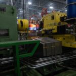 Machinery heats a metal workpiece inside the Mesquite shell plant in Texas.
