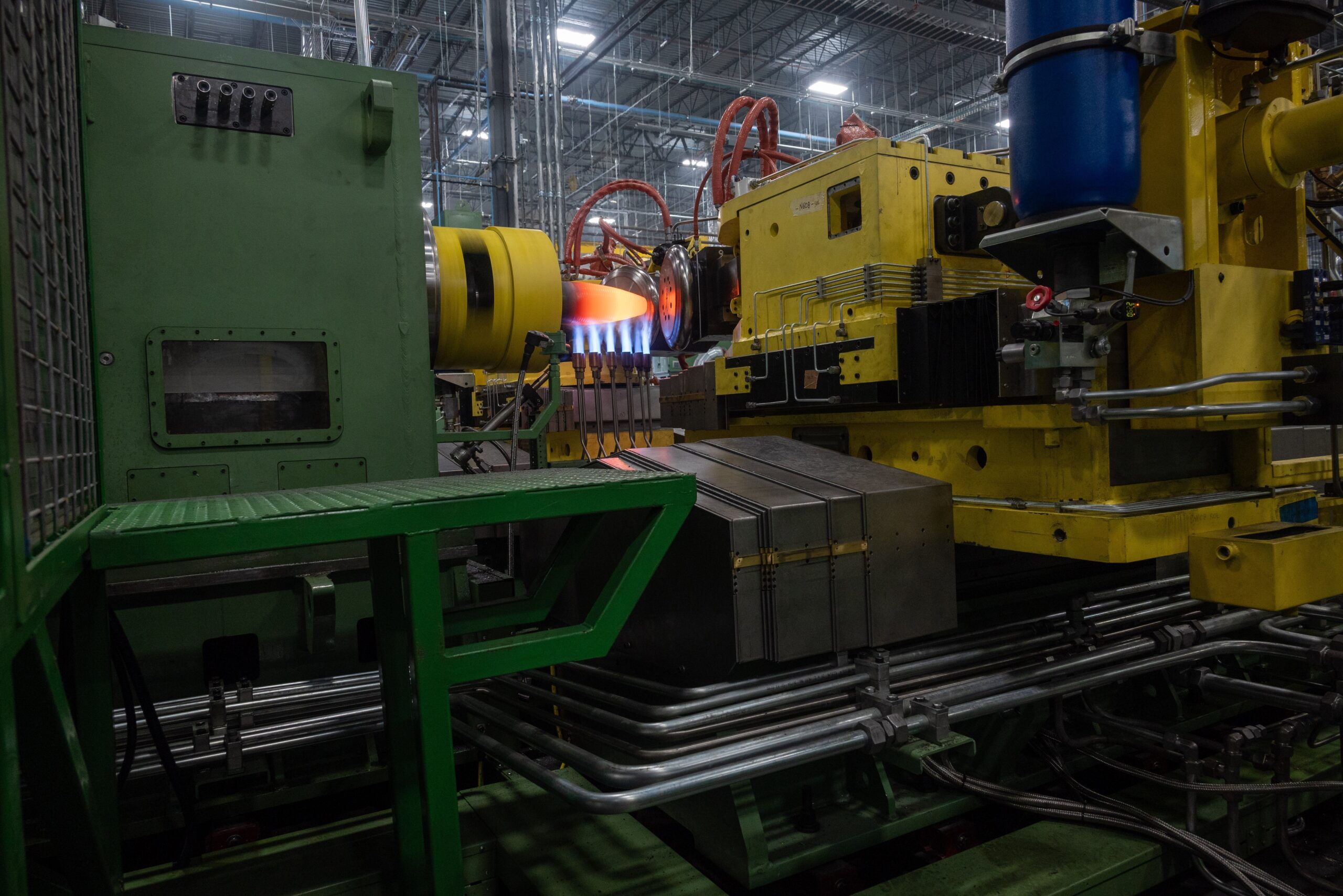 Machinery heats a metal workpiece inside the Mesquite shell plant in Texas.